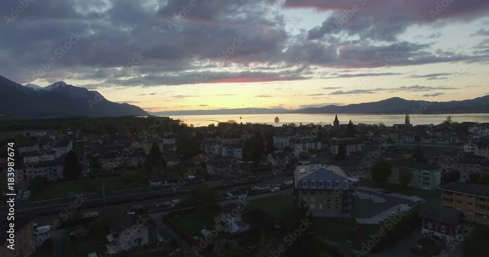 Wide, scenic sunset over city of Villeneuve, Switzerland Wide, scenic sunset over city of Villeneuve, Switzerland