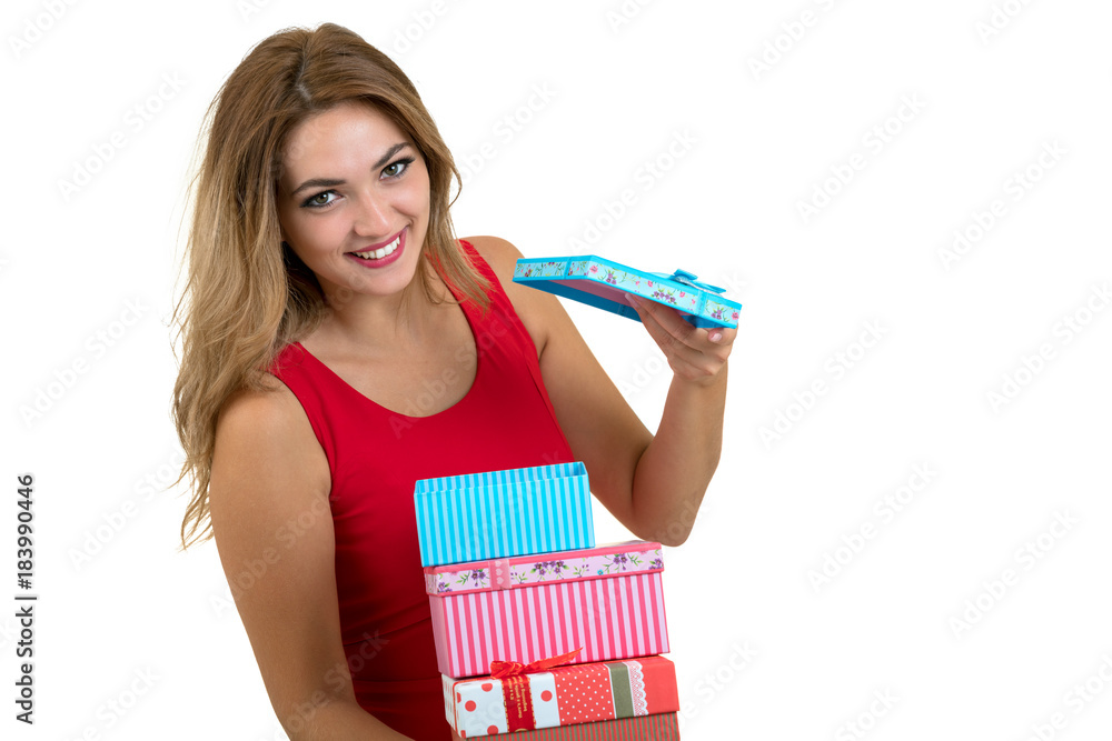 Portrait of a smiling pretty girl holding stack of gift boxes isolated over white background Portrait of a smiling pretty girl holding stack of gift boxes isolated over white background