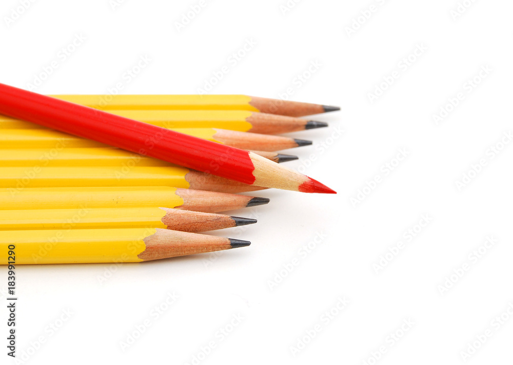 Yellow pencils and one red crayon standing out from the crowd. Isolated on white. Yellow pencils and one red crayon standing out from the crowd. Isolated on white.
