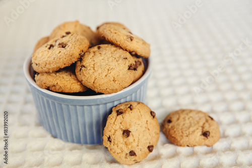 Chocolate chip cookies in little blue bowl
