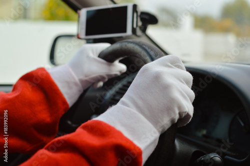 Busy holiday time for Santa Claus driving vehicle carrying delivering presents celebrating joy happiness. Close up on person providing quick transportation service. Rushing people solution concept.