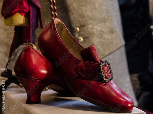 the red shoes, details of red shoes in venetian style for the traditional carnival in venice, italy © marinzolich