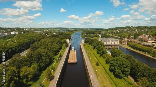 Wallpaper Mural Sluice Gates on the River. Aerial view barge, ship in the river gateway. River sluice construction, water river gateway. Shipping channel. 4K, flying video, aerial footage Torontodigital.ca