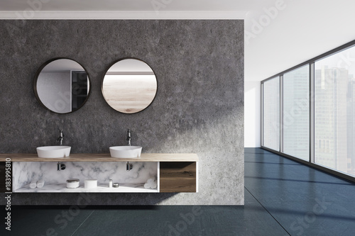 Concrete wall bathroom  sink and mirrors