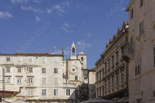 Architectural view of ancient buildings in Narodni square in Split, with its famous tower clock