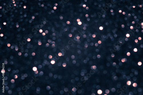 Golden and silver glitter backgound with bokeh abstract blur effect 