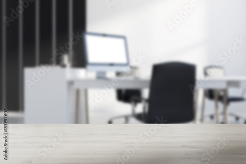White and black office corner computer screen blur