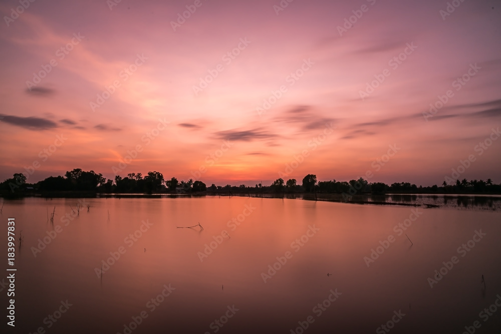 A colorful sunset light in small lake in Thailand