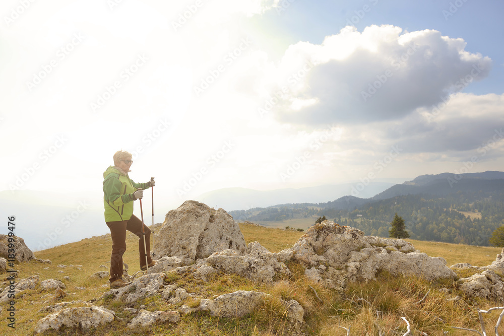 man on top of the mountain pointing at something man on top of the mountain pointing at something