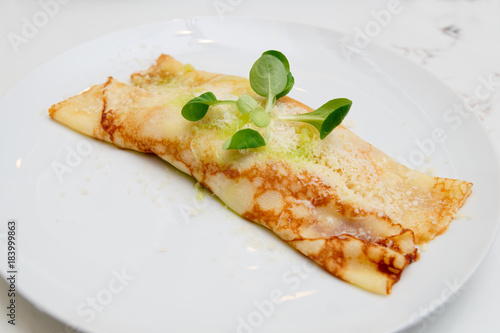 Pancake with cheese on plate