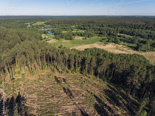 Aerial view over river Merkys valley with the bridge going through near Merkine town, Lithuania. During sunny summer day. photo