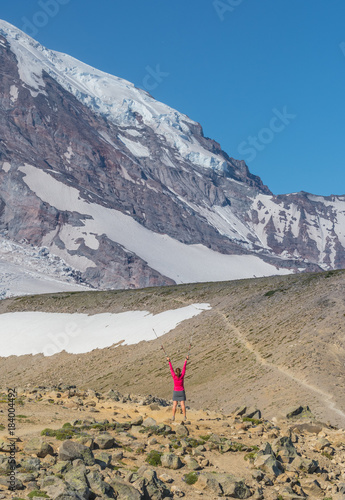 Female Hiker Celebrates a Majestic View photo