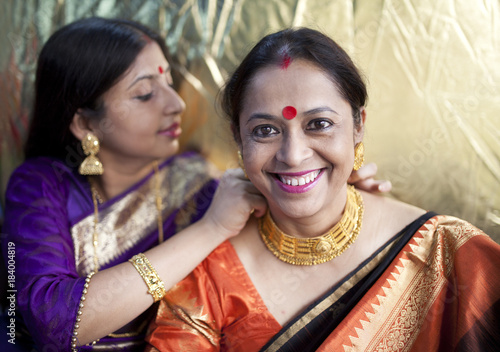 Fashionable & Cheerful Adult Indian woman with traditional dress photo