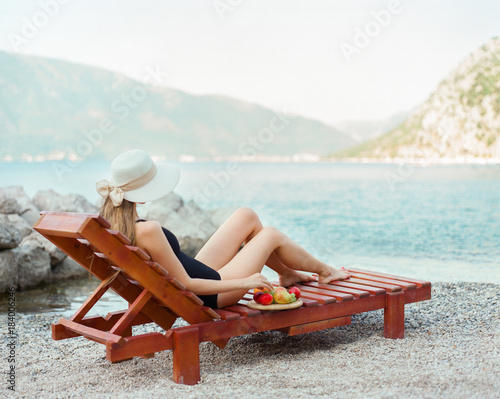 Back view of woman on sunbed