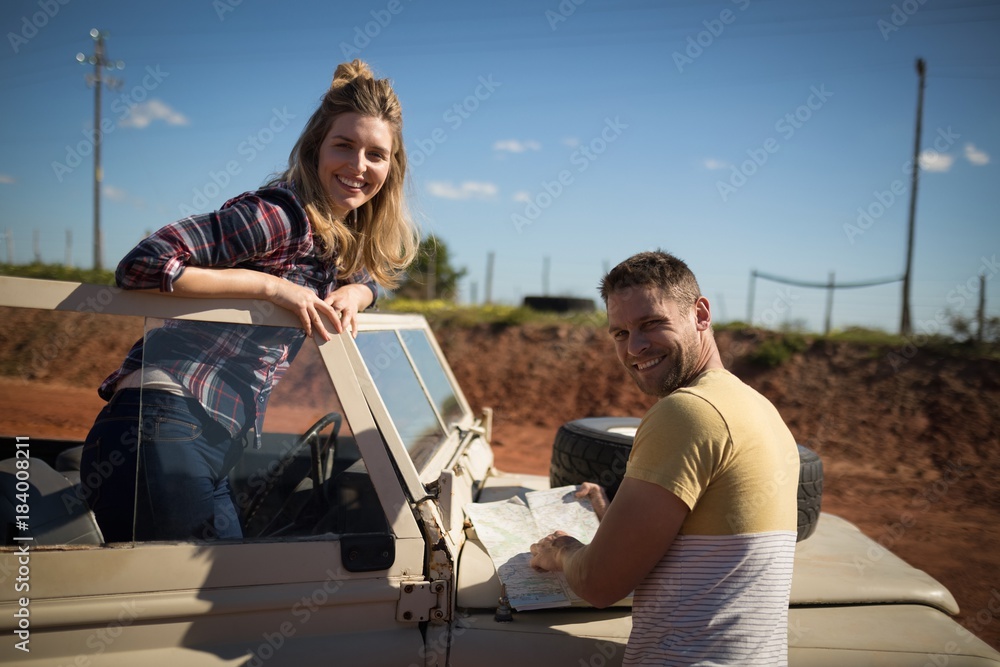Fototapeta premium Couple looking at map on a sunny day