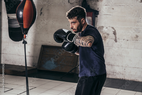Athlete boxing in a gym photo