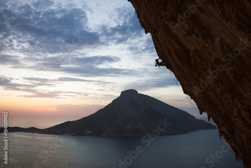Rock climber climbing a steep overhang