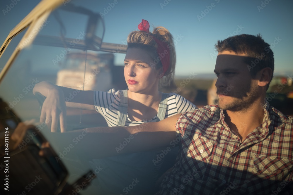 Couple sitting together in a car