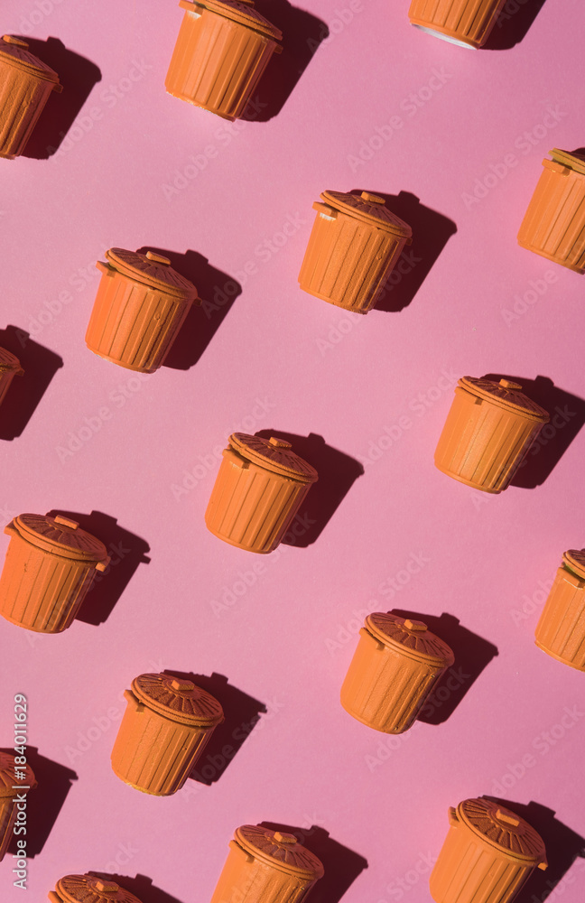 Orange garbage cans on pink background. Orange garbage cans on pink background.