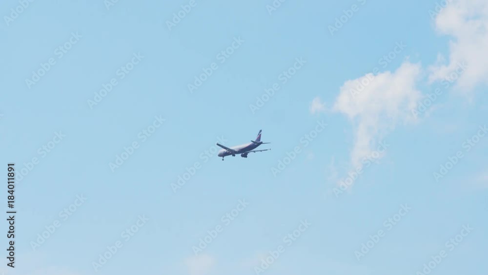 Large commercial aircraft comes in for landing. Flying airplane. Landing of the passenger plane at sunset time. 4k. Large commercial aircraft comes in for landing. Flying airplane. Landing of the passenger plane at sunset time. 4k.