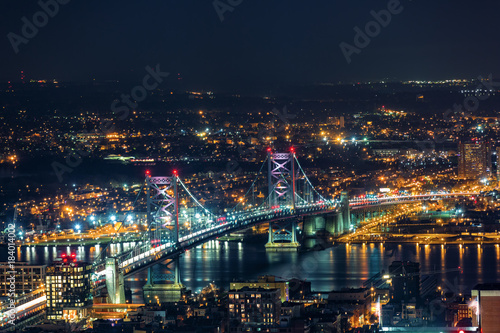Aerail view of Ben Franklin Bridge by night spaning Delaware river  in Philadelphia