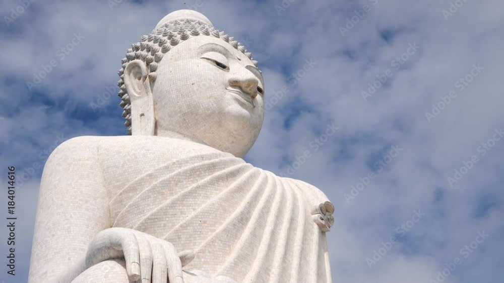 White Big Buddha Temple. Clouds Run in the Sky Over the Sitting Statue. 4K Time lapse. Phuket, Thailand. White Big Buddha Temple. Clouds Run in the Sky Over the Sitting Statue. 4K Time lapse. Phuket, Thailand.