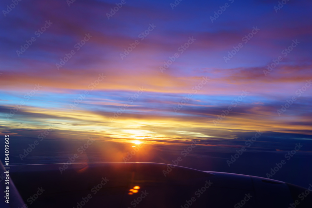 beautiful view of cloud and sky from the windows of airplane flying when the sunset at attitude 32000 feets beautiful view of cloud and sky from the windows of airplane flying when the sunset at attitude 32000 feets