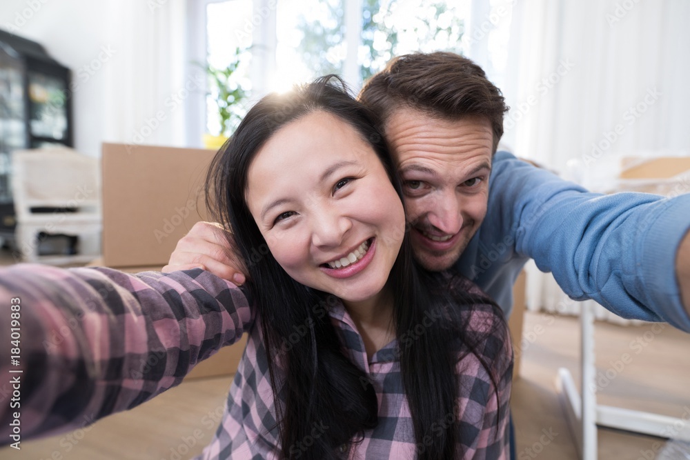 Couple having fun at their new house Couple having fun at their new house