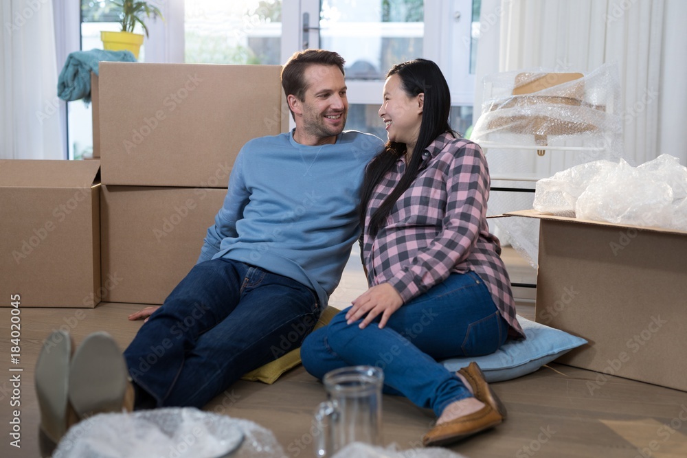 Couple relaxing together at their new home Couple relaxing together at their new home
