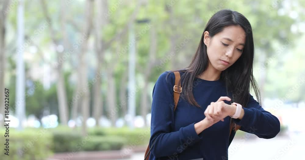 Woman use of smart watch at outdoor Woman use of smart watch at outdoor