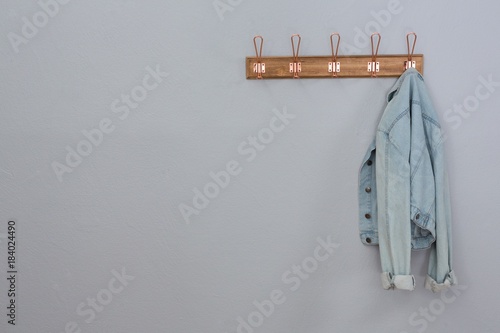 Denim jacket hanging on hook