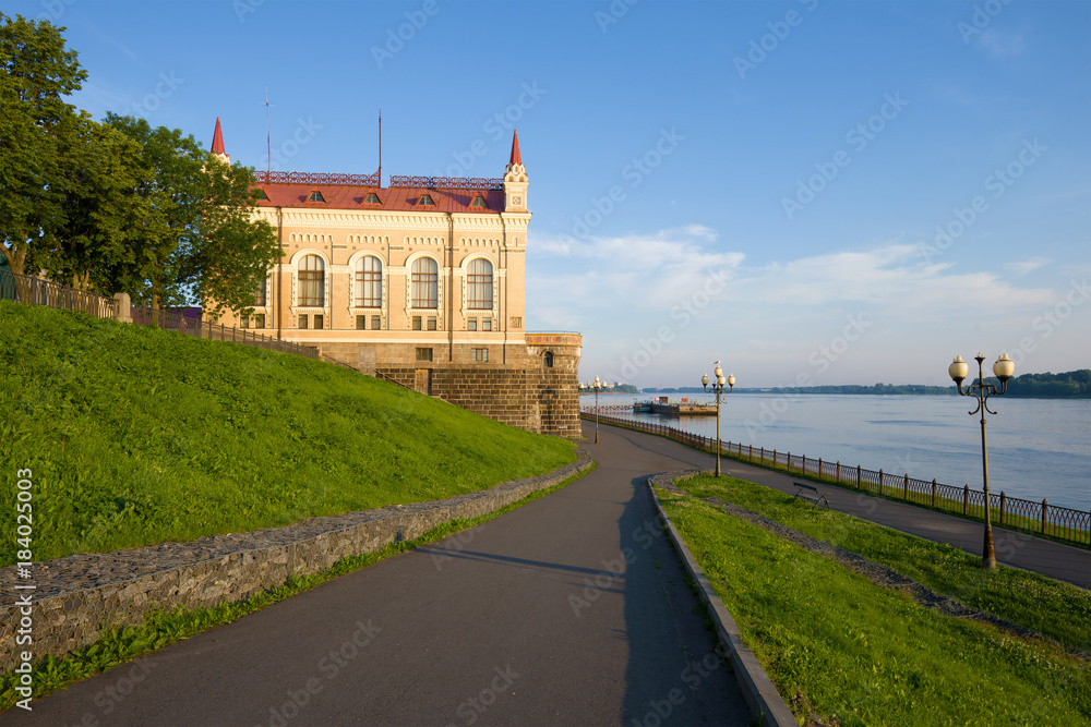 Old building of the former grain market on the Volga river embankment in the morning of July. Rybinsk, Russia