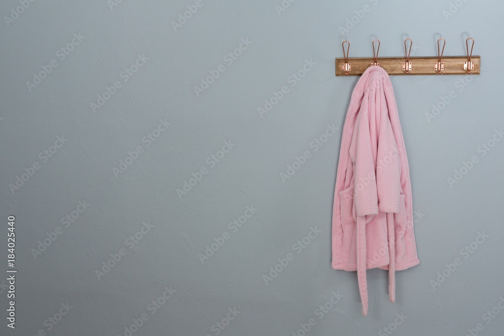 Fototapeta premium Bathrobes hanging on hook