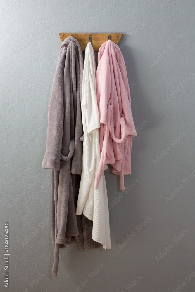 Fototapeta premium Bathrobes hanging on hook
