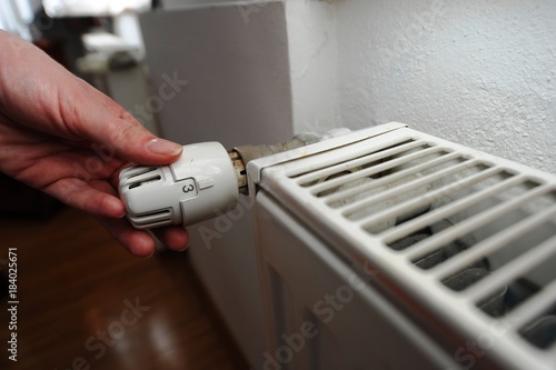 The valve of a home radiator adjusting the temperature in the room