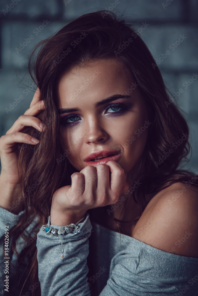 Portrait of a sexy woman with makeup and beautiful hair. Portrait of a sexy woman with makeup and beautiful hair.