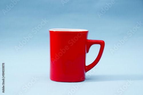 Red Mug Over Blue Background
