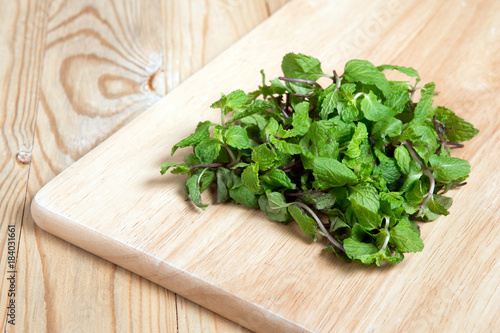 a pile of peppermint on a wood block