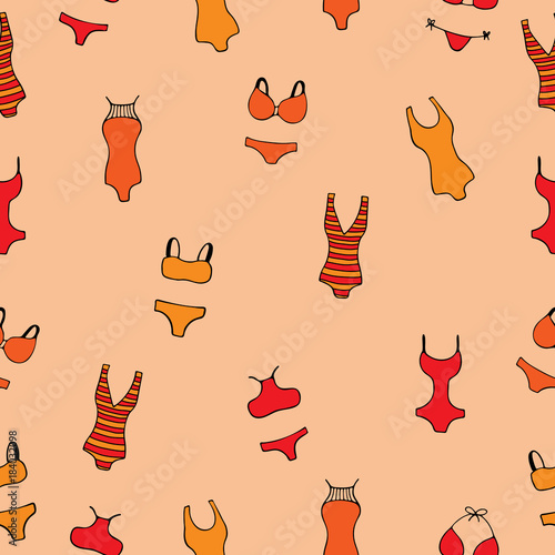 Seamless pattern with women's bathing suits on a peach background.