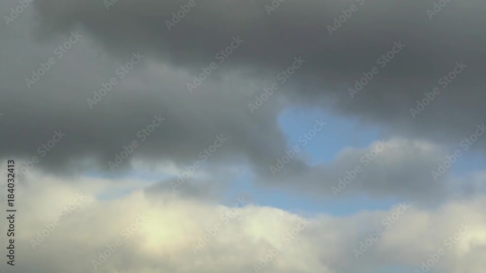 Low winter clouds move from right to left in the blue sky. TimeLapse. Low winter clouds move from right to left in the blue sky. TimeLapse.