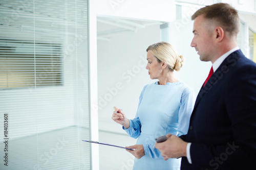 New owners of office looking over while checking its condition