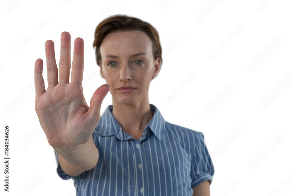 Female executive pretending to use an invisible screen Female executive pretending to use an invisible screen