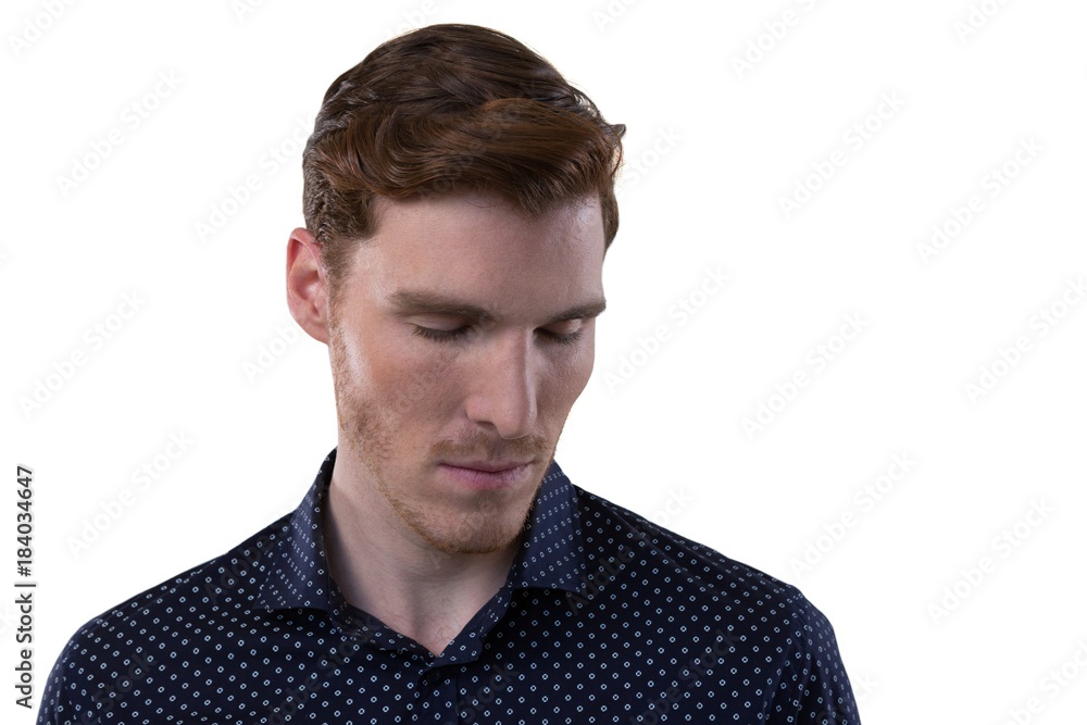 Obraz premium Male executive standing with eyes closed
