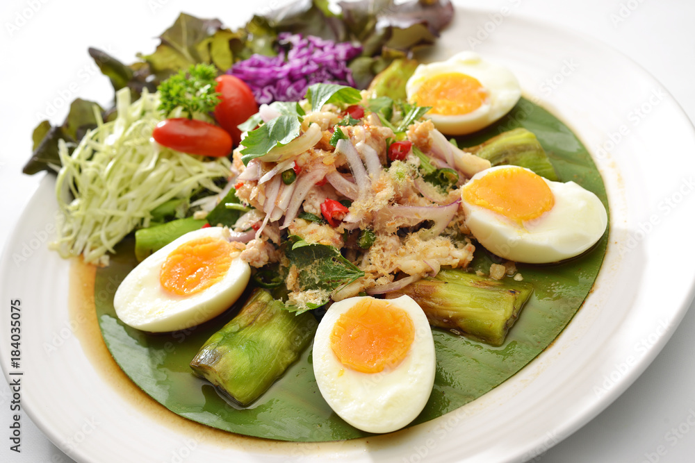 Thai Hot Spicy Salad eggplant and half boiled egg see yolk eat with many vegetable and Chilli Thai Hot Spicy Salad eggplant and half boiled egg see yolk eat with many vegetable and Chilli