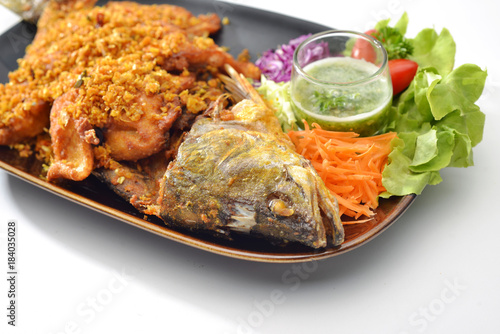 Sea Fish Fried with garlic and pepper eat together with Thai Seafood Sauce