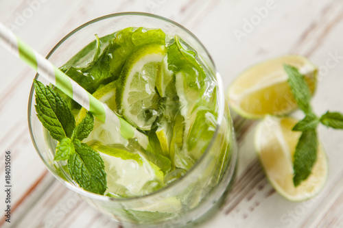 Mojito cocktail on white wood background