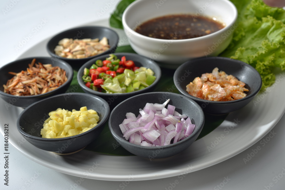 Thai Food wrapped in leaves include many Thai spices are shallots, ginger, chilli, coconut burns, lemon and Ayesha rocket leaves eat with chilli sauce tamarind together Thai Food wrapped in leaves include many Thai spices are shallots, ginger, chilli, coconut burns, lemon and Ayesha rocket leaves eat with chilli sauce tamarind together