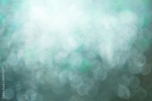 Abstract blurred bokeh of blue twinkled glitter use for christmas background.