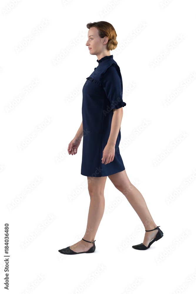 Female executive walking against white background Female executive walking against white background
