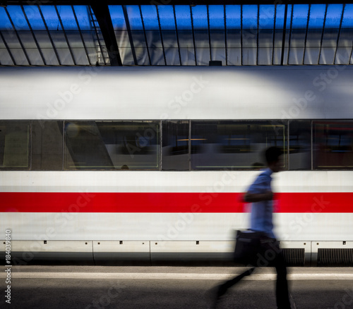 Person rushing on a train station platform